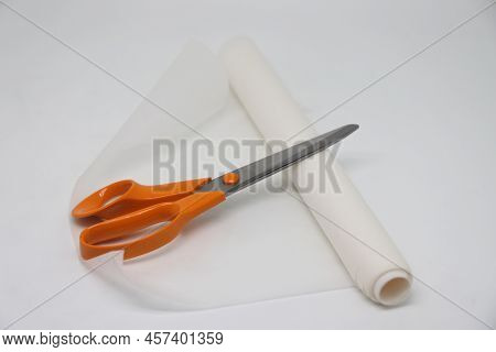 Roll Of Waxed Baking Paper, Parchment Paper, Scissors.