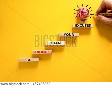 Be Stronger Symbol. Concept Words Be Stronger Than Your Excuses On Wooden Blocks On A Beautiful Yell