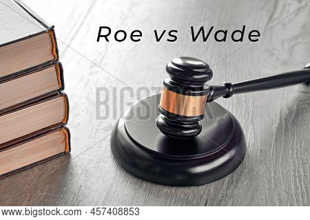 Roe Versus Wade Text. Law Hammer And Old Books On Wooden Table.