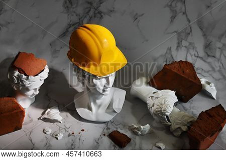 Gypsum Heads Of Ancient Heroes, Head Of David In Yellow Helmet Is Protected, Other Heads Are Damaged