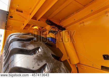 Huge Rear Wheels Of Dump Truck At Unusual Angle Closeup.