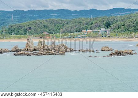 Rock Formations In Ocean Water Off Shore Near Ulsan, South Korea. Aka Gunham Rock.