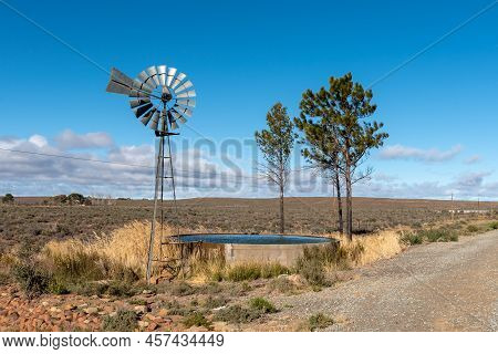 Landscape On Road R63 Between Victoria West And Loxton In The Northern Cape Province. A Water-pumpin