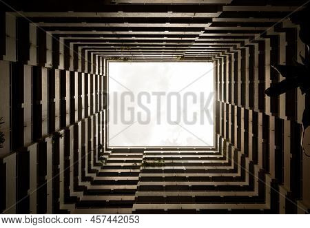 Bottoms Up View Of The Cascading Rectangular Corridors Balcony Opening Up Of Residential Buildings A