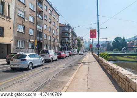 Sarajevo, Bosnia And Herzegovina - June 3, 2022: Obala Kulina Bana Street. Street Along Miljacka Riv