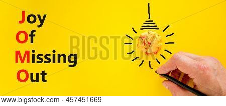 Jomo Joy Of Missing Out Symbol. Concept Words Jomo Joy Of Missing Out On Beautiful Yellow Background
