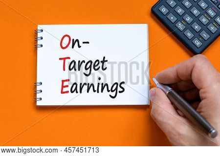Ote On-target Earnings Symbol. Concept Words Ote On-target Earnings On White Note On A Beautiful Ora