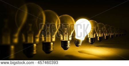 Glowing Light Bulb On Orange Background, Idea Concept