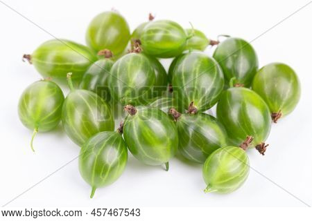 Isolated Agrus. Pile Of Green Gooseberries  On White Background.