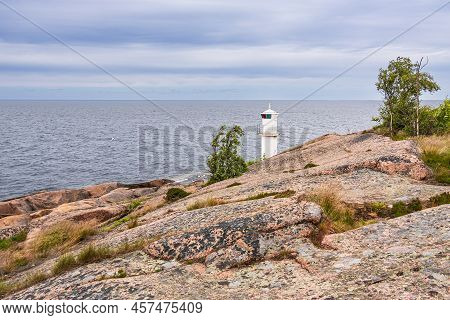 Landscape With Rocks And Lighthouse On The Island Blå Jungfrun In Sweden.