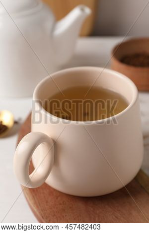 Cup Of Aromatic Buckwheat Tea On Table, Closeup