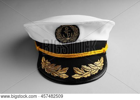 Peaked Cap With Accessories On Light Grey Background