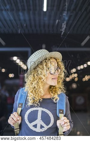 Portrait Of Attractive Young Adult Woman In Travel With Backpack In Airport Gate Station. Concept Of