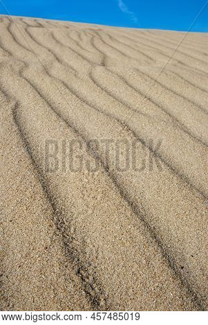 Detail Of A Rippled Dune With A Clear Blue Ssky On Top