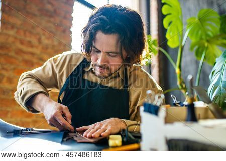 Hobby Became A Small Business Leather Man In Apron Is Making A Leather Wallet And Shooes In Studio