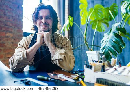 Hobby Became A Small Business Leather Man In Apron Is Making A Leather Wallet And Shooes In Studio