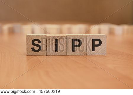 American Economy And Business Concept. Wooden Cubes With The Inscription - Sipp - Self-invested Pens