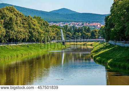 Nitra, Slovakia - 06.16.2022: View Of The Slovak City Of Nitra. View Of The Nitra River, A Modern Br
