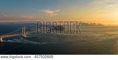 Panoramic Aerial View Of Naruto Bridge And Whirlpools At Sunset