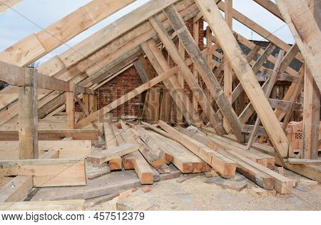 Roofing Construction And Framing Of A New House. Timber Trusses, Roof Framing With A Close-up Of Roo