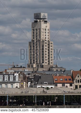 Antwerp, Belgium, 01-07-2022, Right Bank Of The River Scheldt In Antwerp With The Tall Kbc Building