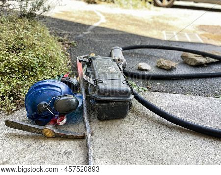 Menthon Saint Bernard, France - September 07 2021: A Professional Worker Is Busy With A Pump Car And