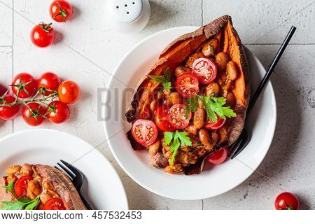 Baked Whole Sweet Potato Stuffed With Beans And Tomato, Top View. Vegan Recipe Concept.