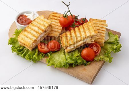 Tasty Club Sandwiches With Ham And Cheese On Wooden Table. Grilled And Pressed Toast With Smoked Ham