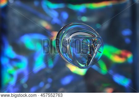 Drop Of Cosmetic Transparent Gel On A Halographic Background. The Texture Of The Serum, Heir Gel Or 