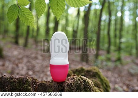 Roll-on Deodorant Antiperspirant Staying On The Wood In The Forest, Beautiful Natural Background Wit