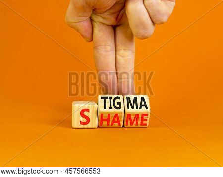 Stigma Or Shame Symbol. Concept Words Stigma Or Shame On Wooden Cubes. Businessman Hand. Beautiful O
