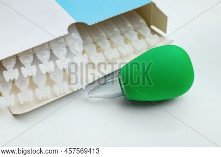 Package With Single Dose Ampoules Of Sterile Isotonic Sea Water Solution And Nasal Aspirator On Whit