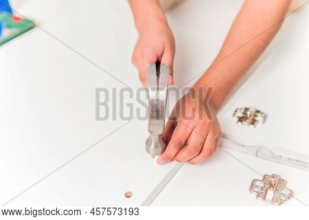 Latin Bolivian Strong And Independent Success Woman Assembly And Repair Furniture With Hammer.