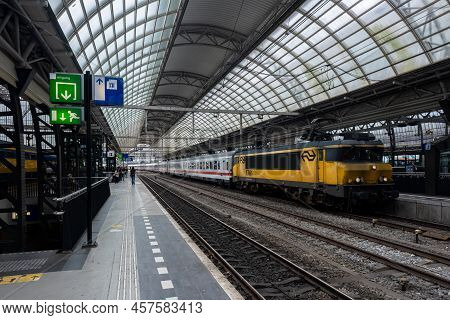 Amsterdam, The Netherlands - 21 June 2022: Nederlandse Spoorwegen Train In Amsterdam Central Station