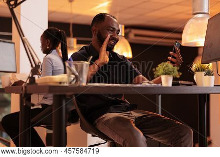 Office Employee Using Videocall Conference On Smartphone, Having Remote Conversation With Colleagues