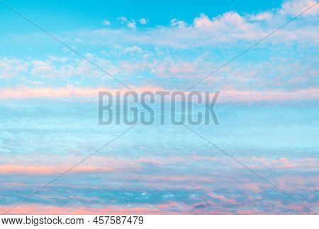 Panorama Of Sky With Pink Clouds At Sunset Or Sunrise. Abstract Background With Pink, Purple And Blu