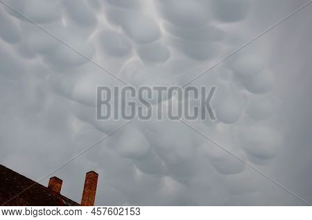 Storm Clouds Of Fluffy Puffy Shape The Beginning Of A Bubble-shaped Thunderstorm, Steel-gray Color T