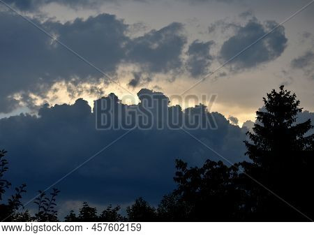 Storm Clouds Of Fluffy Puffy Shape The Beginning Of A Bubble-shaped Thunderstorm, Steel-gray Color T