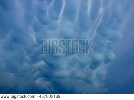 Storm Clouds Of Fluffy Puffy Shape The Beginning Of A Bubble-shaped Thunderstorm, Steel-gray Color T
