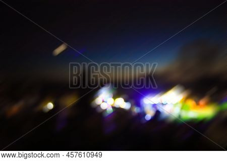 Abstract Blurred City View And Road With Cars Lights At Night. Defocused Traffic Lights.