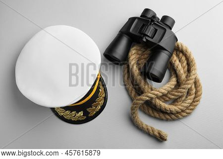 Peaked Cap, Rope And Binoculars On Light Grey Background, Flat Lay