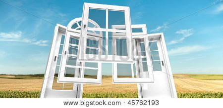 Selección de puertas y ventanas con un paisaje rural en el fondo