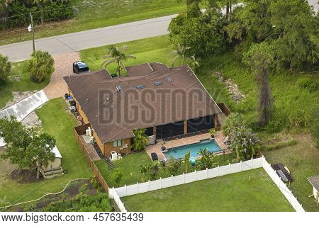 Aerial View Of Typical Contemporary American Private House With Roof Top Covered With Asphalt Shingl