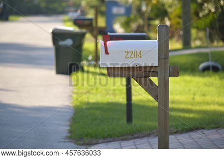 Typical American Outdoors Mail Box On Suburban Street Side