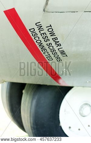 Tow Bar Limit Unless Scissors Disconnected Decal On An Old Aircraft.