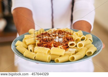 Close Up Of Fresh And Tasty Italian Pasta Food With Bolognese Ragu Sauce - Unrecognizable Man Defocu