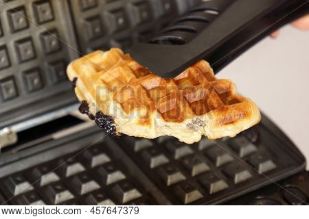 Croffle Croissant And Waffle. Preparation Process Making. Selective Focus