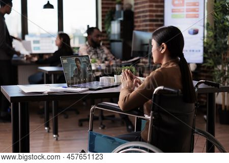 Employee With Physical Disability Talking On Online Videocall, Meeting With Man On Internet Teleconf