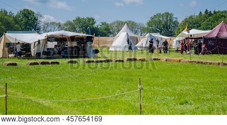 Schleswig Holstein, Germany, June 18, 2022: Battleground And In The Background A Tent Camp At A Medi