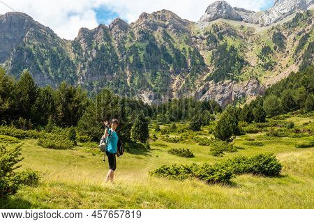 A Young Woman Climbing The Mountain To The Piedrafita Arch, Alto Gallego, Huesca, Aragon